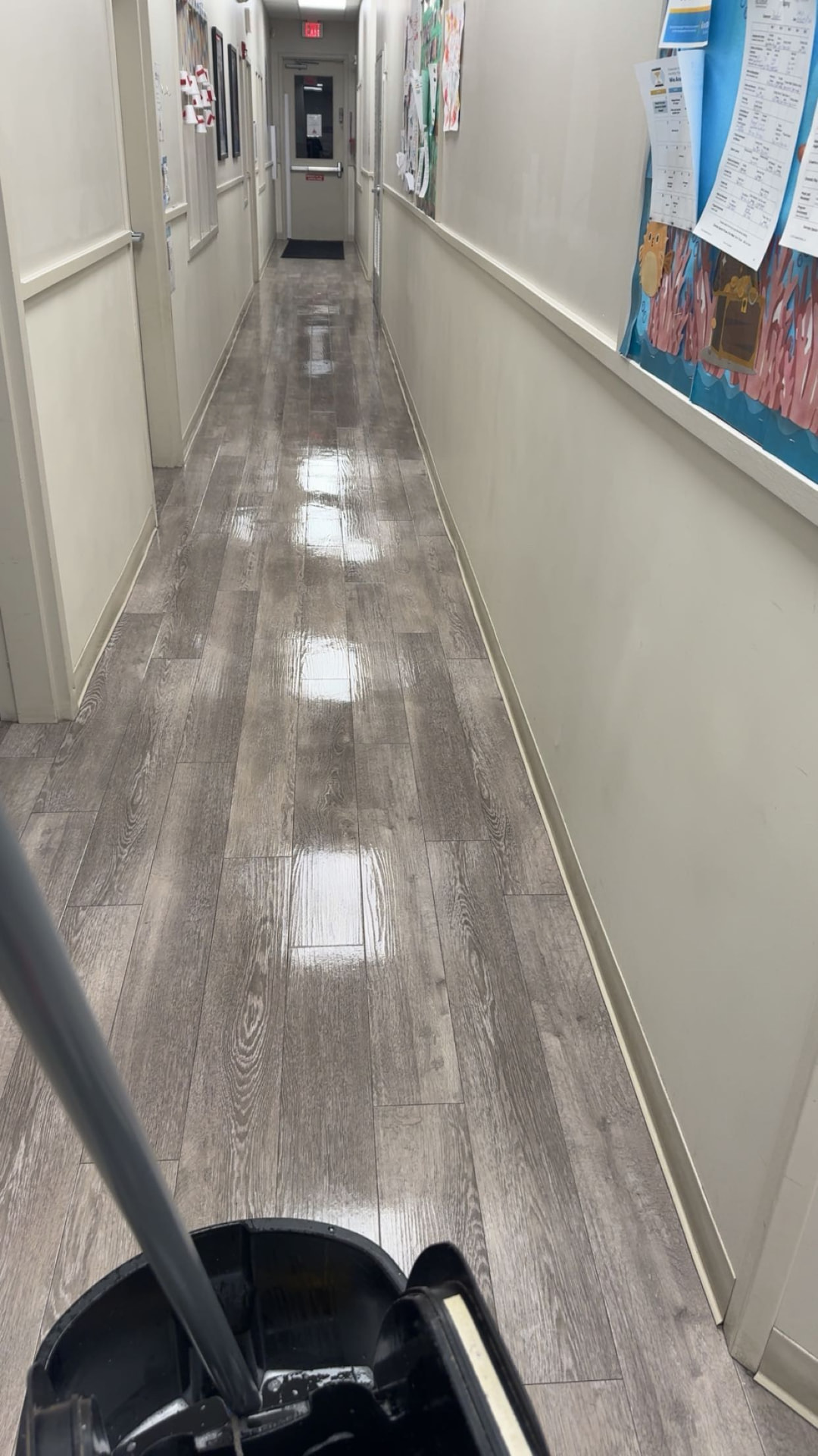 Shiny, freshly mopped hallway floor